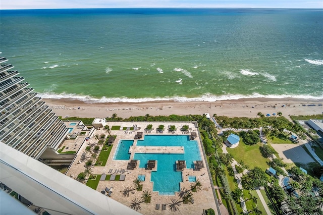 drone / aerial view with a water view and a view of the beach