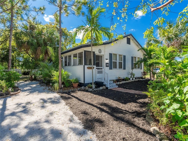 view of front of property with a sunroom