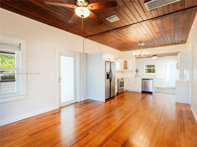 kitchen featuring visible vents, a healthy amount of sunlight, light wood-type flooring, appliances with stainless steel finishes, and white cabinets