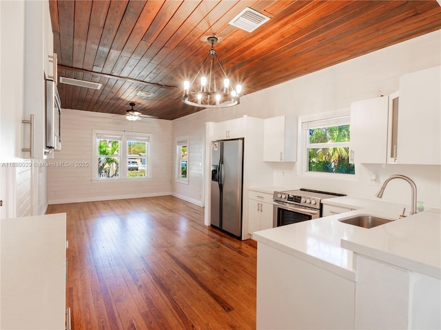 kitchen featuring a wealth of natural light, visible vents, appliances with stainless steel finishes, and a sink