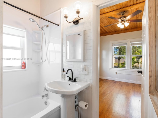 bathroom featuring wood-type flooring, tub / shower combination, wooden ceiling, ceiling fan, and decorative backsplash