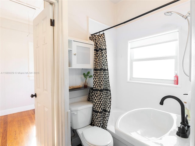 full bathroom featuring shower / tub combo, toilet, sink, and hardwood / wood-style floors