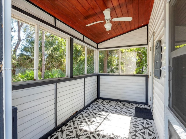 unfurnished sunroom featuring ceiling fan, lofted ceiling, and wood ceiling