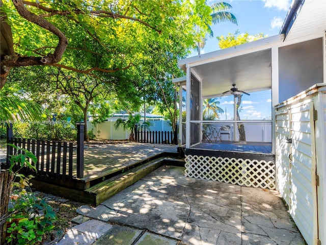 view of patio with a wooden deck and ceiling fan