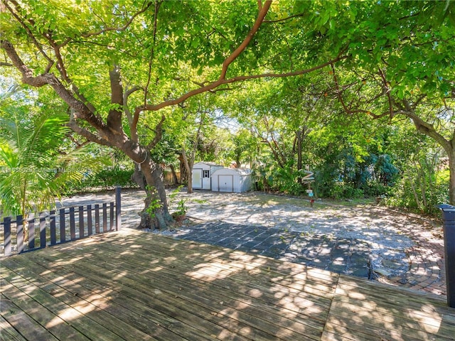 wooden deck with a shed