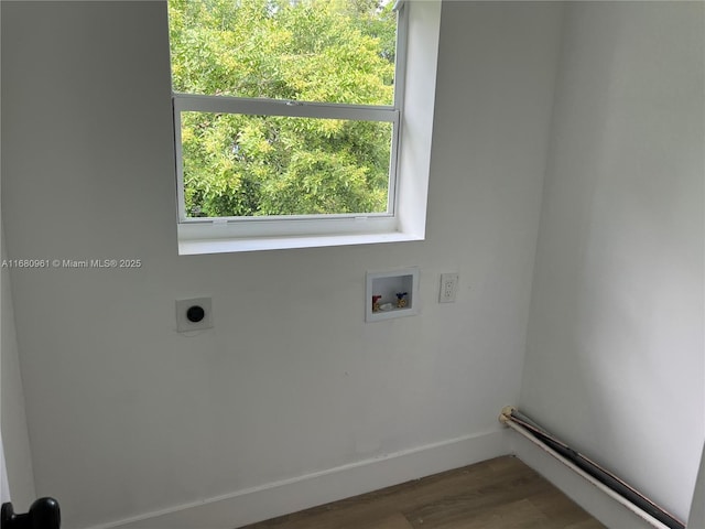washroom featuring washer hookup, wood finished floors, baseboards, hookup for an electric dryer, and laundry area