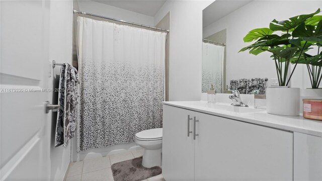 tiled bedroom featuring sink and ceiling fan