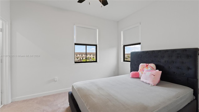 bedroom with ceiling fan and carpet flooring