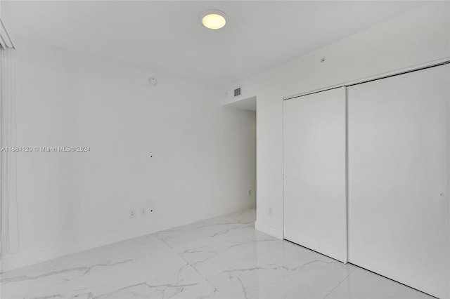 unfurnished bedroom featuring a closet