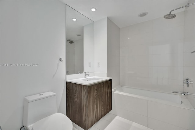 full bathroom featuring tile patterned flooring, vanity, toilet, and tiled shower / bath