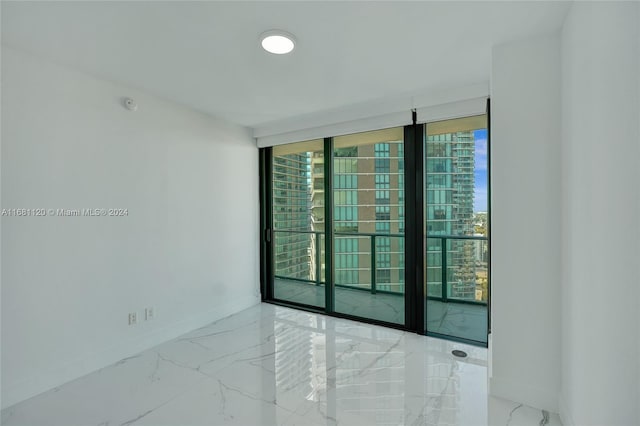 spare room featuring expansive windows