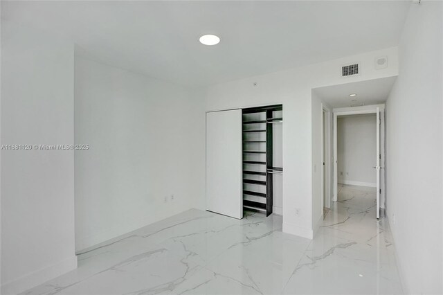 bathroom with tile patterned flooring, vanity, toilet, and walk in shower