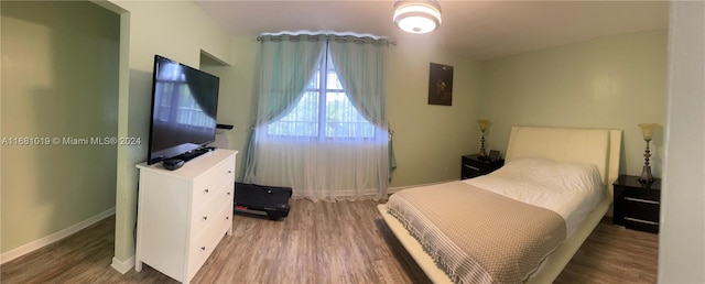 bedroom with hardwood / wood-style flooring