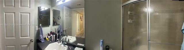 bathroom featuring vanity and walk in shower