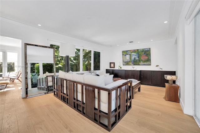 bedroom with french doors, light hardwood / wood-style floors, and crown molding