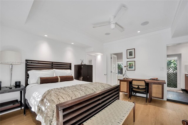 bedroom featuring ornamental molding, light hardwood / wood-style flooring, and ceiling fan