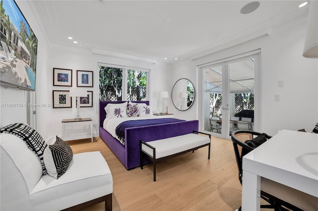 bedroom with light hardwood / wood-style floors, crown molding, multiple windows, and access to exterior