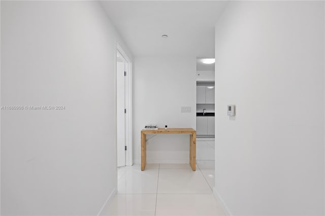 hallway with light tile patterned floors