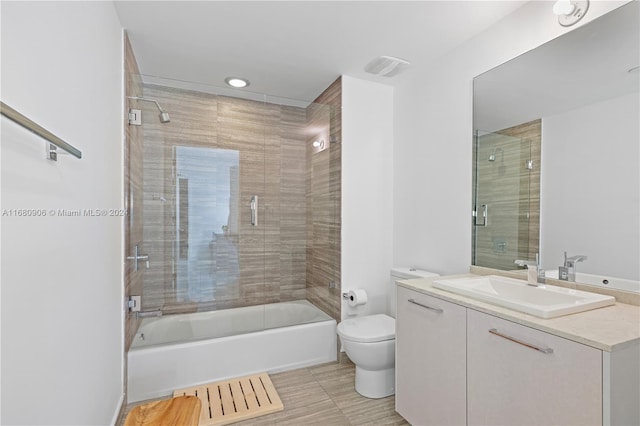 full bathroom with toilet, combined bath / shower with glass door, vanity, and tile patterned flooring