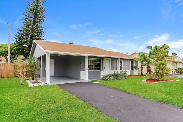 ranch-style house with a front lawn and a carport