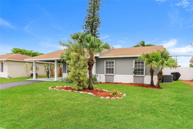 single story home featuring a front lawn