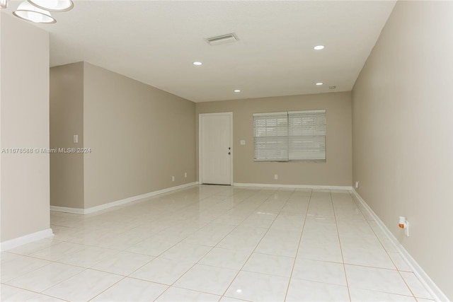 unfurnished room with light tile patterned floors