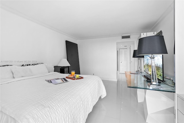 bedroom featuring light tile patterned flooring and ornamental molding