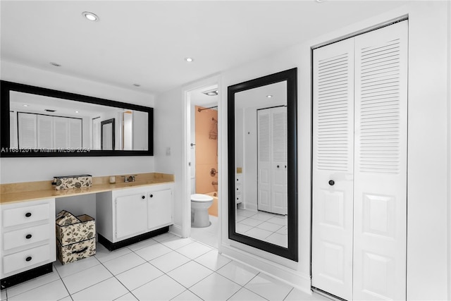 bathroom with tile patterned floors, vanity, and toilet