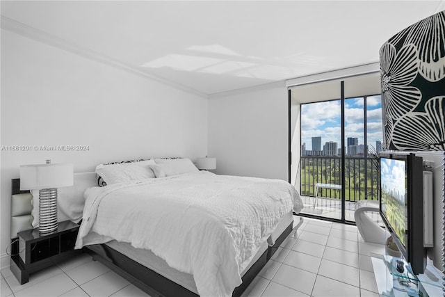 bedroom featuring access to exterior, a wall of windows, ornamental molding, and light tile patterned flooring