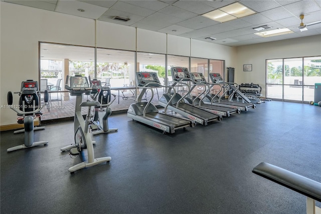 exercise room featuring a paneled ceiling and visible vents