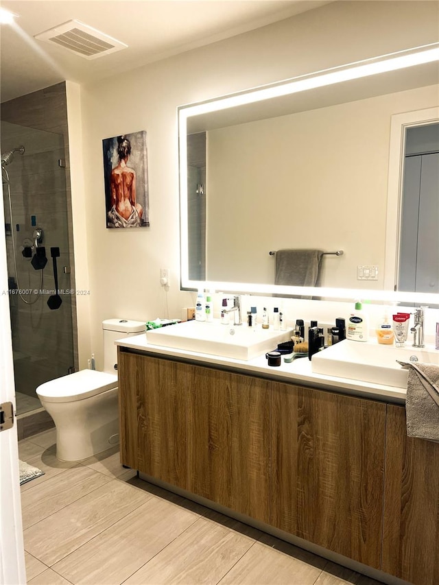 bathroom featuring vanity, toilet, a shower with shower door, and hardwood / wood-style floors