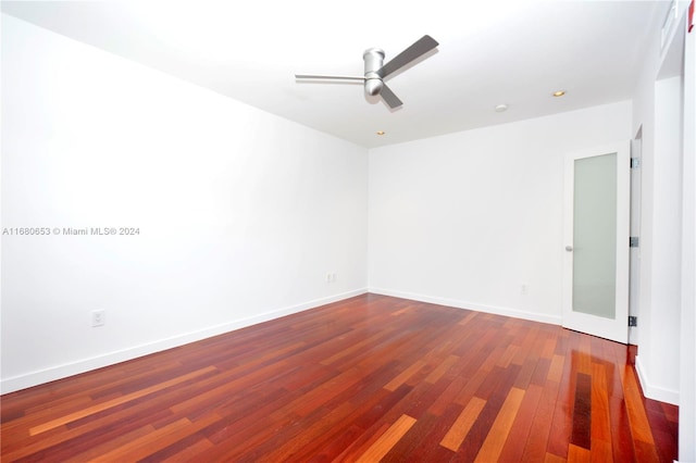 empty room featuring ceiling fan and hardwood / wood-style flooring