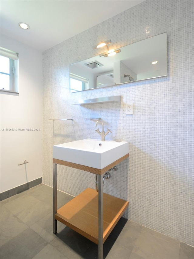 bathroom featuring tile walls and tile patterned flooring