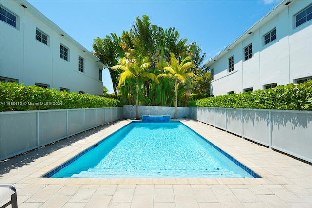 view of pool featuring a patio