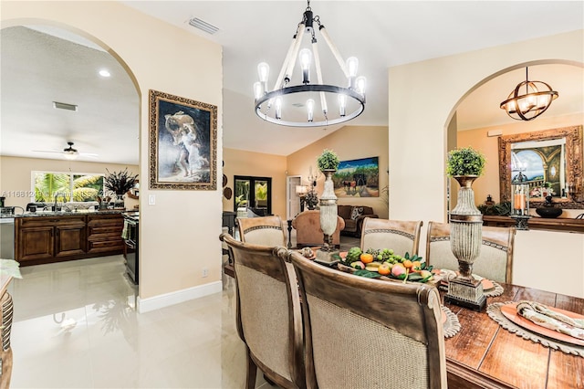 12288 N 82nd Ln N, West Palm Beach, FL 33412 - dining room with a chandelier, arched walkways, baseboards, vaulted ceiling, and ceiling fan