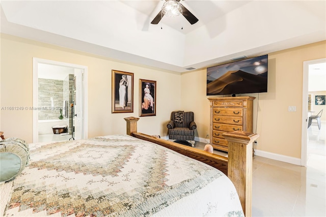 tiled bedroom with ceiling fan and connected bathroom