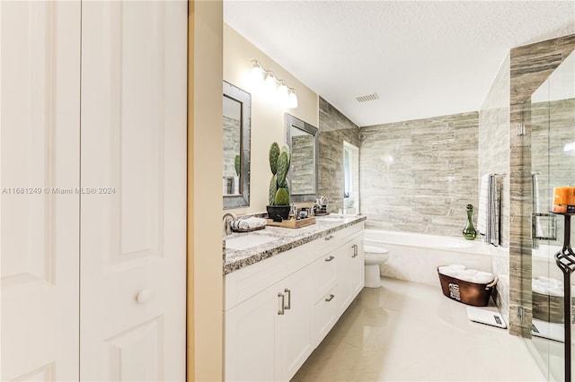 full bathroom with a textured ceiling, vanity, plus walk in shower, tile patterned floors, and toilet