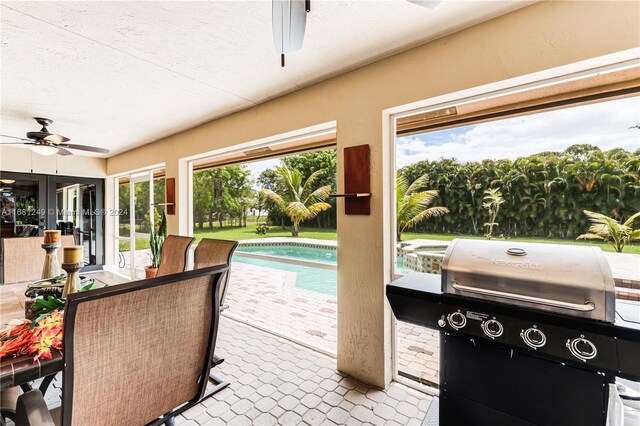 12288 N 82nd Ln N, West Palm Beach, FL 33412 - view of patio / terrace featuring ceiling fan, grilling area, an outdoor pool, and french doors