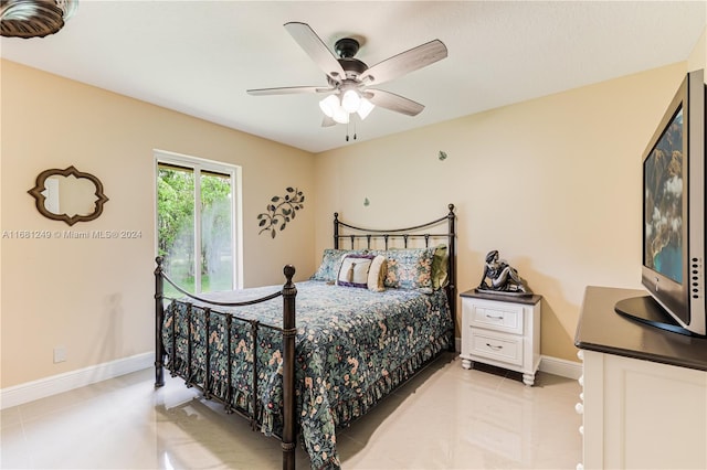12288 N 82nd Ln N, West Palm Beach, FL 33412 - bedroom featuring baseboards, light tile patterned flooring, and a ceiling fan