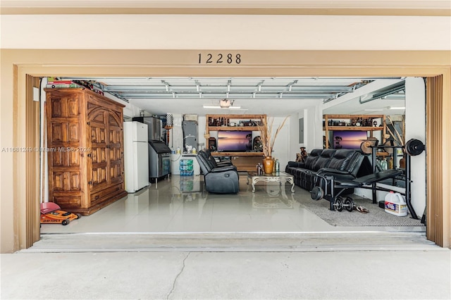 12288 N 82nd Ln N, West Palm Beach, FL 33412 - garage featuring freestanding refrigerator and electric panel