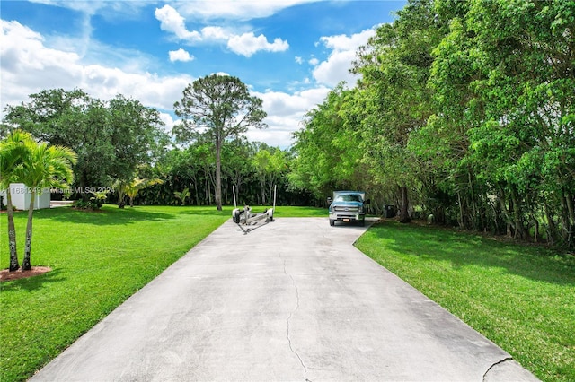 12288 N 82nd Ln N, West Palm Beach, FL 33412 - view of street featuring view of wooded area