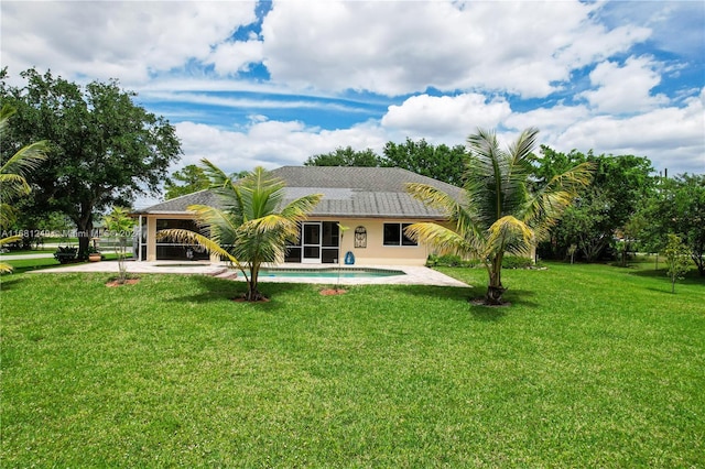 12288 N 82nd Ln N, West Palm Beach, FL 33412 - rear view of house with an outdoor pool and a yard