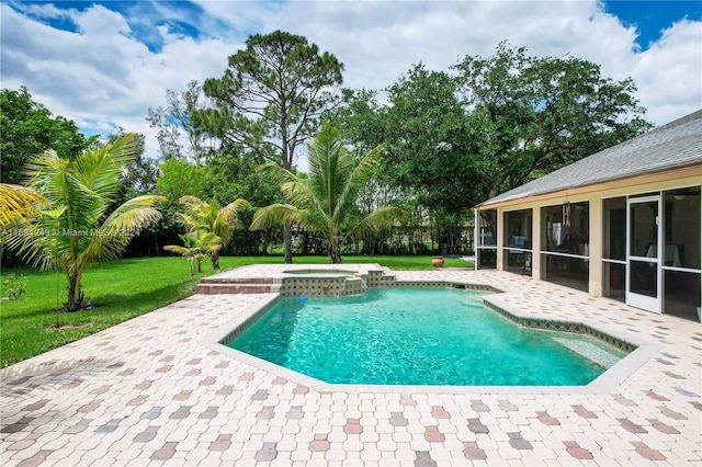 view of pool featuring a patio area, a lawn, a sunroom, and an in ground hot tub