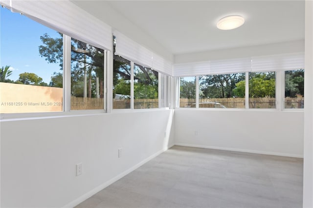 unfurnished sunroom with plenty of natural light