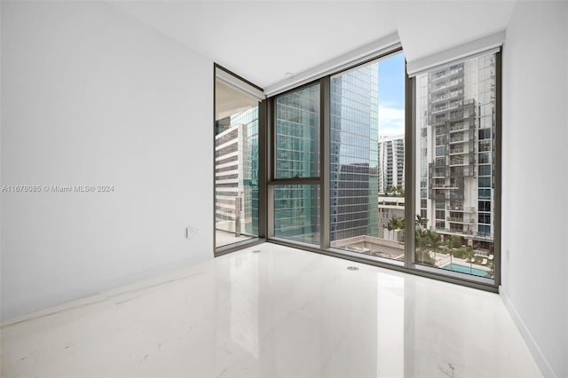 spare room featuring floor to ceiling windows