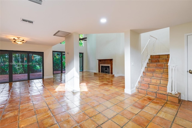 unfurnished living room with light tile patterned floors