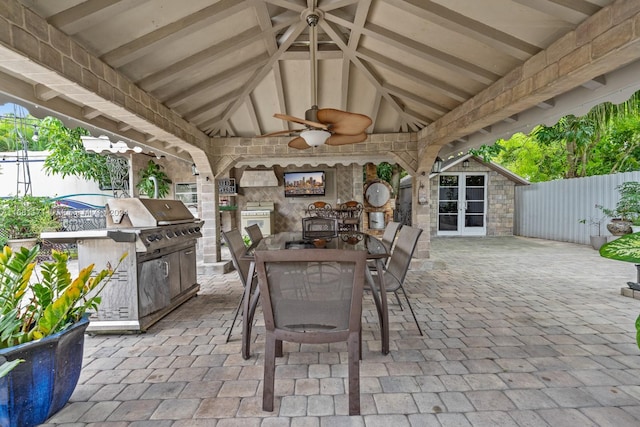 view of patio / terrace with exterior kitchen and ceiling fan