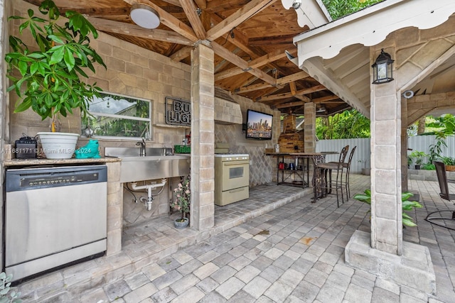 view of patio featuring an outdoor wet bar