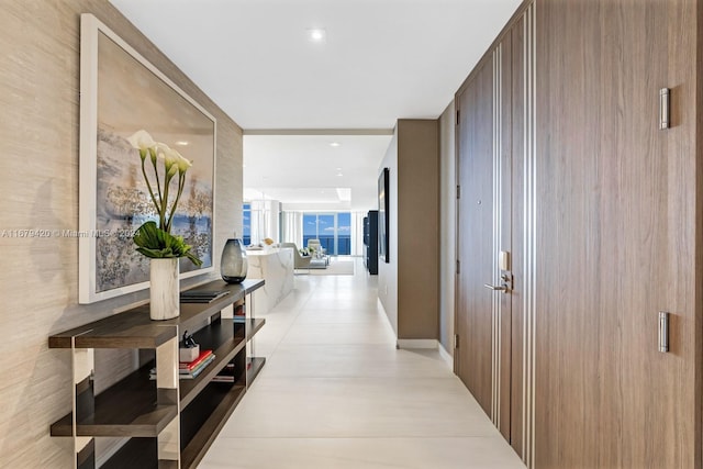 hallway featuring floor to ceiling windows