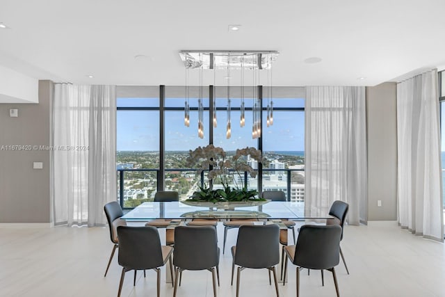 dining area featuring plenty of natural light and floor to ceiling windows